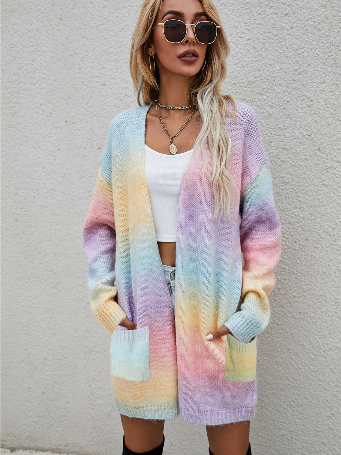 Rainbow gradient knit cardigan with pockets and open front.