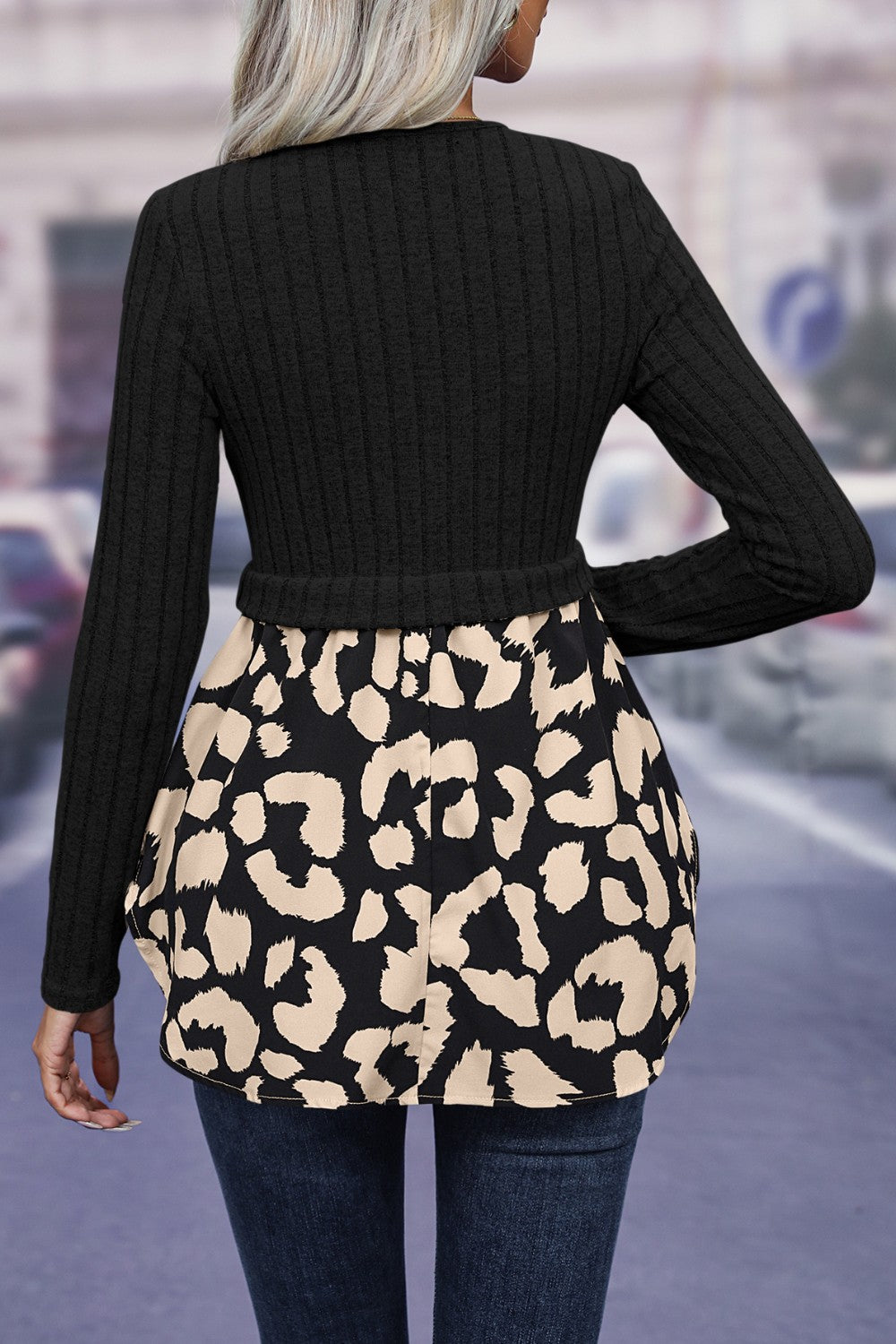Black ribbed knit peplum blouse with leopard print skirt detail