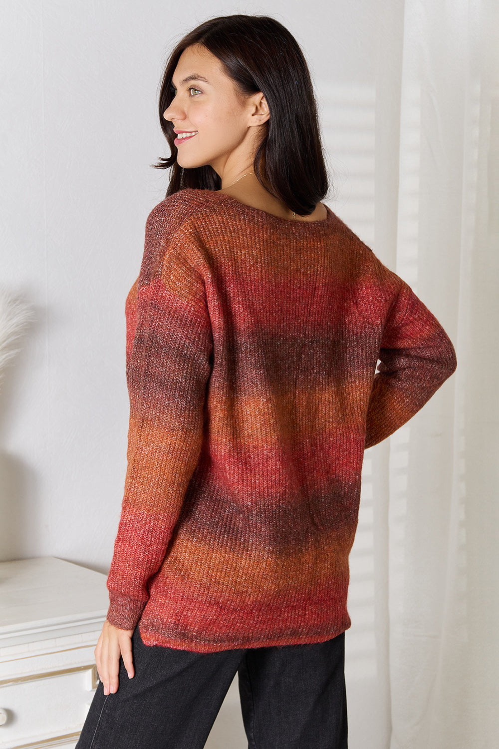 Sunset Stripe Slouchy V-Neck Knit sweater in Brick Red, featuring horizontal stripes and a relaxed fit.
