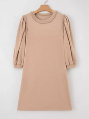Braided puff sleeve khaki dress with crew neck and cuffed sleeves.