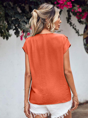 Orange-red textured V-neck flutter sleeve blouse with a casual fit.