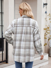 Oversized plaid shirt jacket in white with brown checks, long sleeves, and buttoned front.