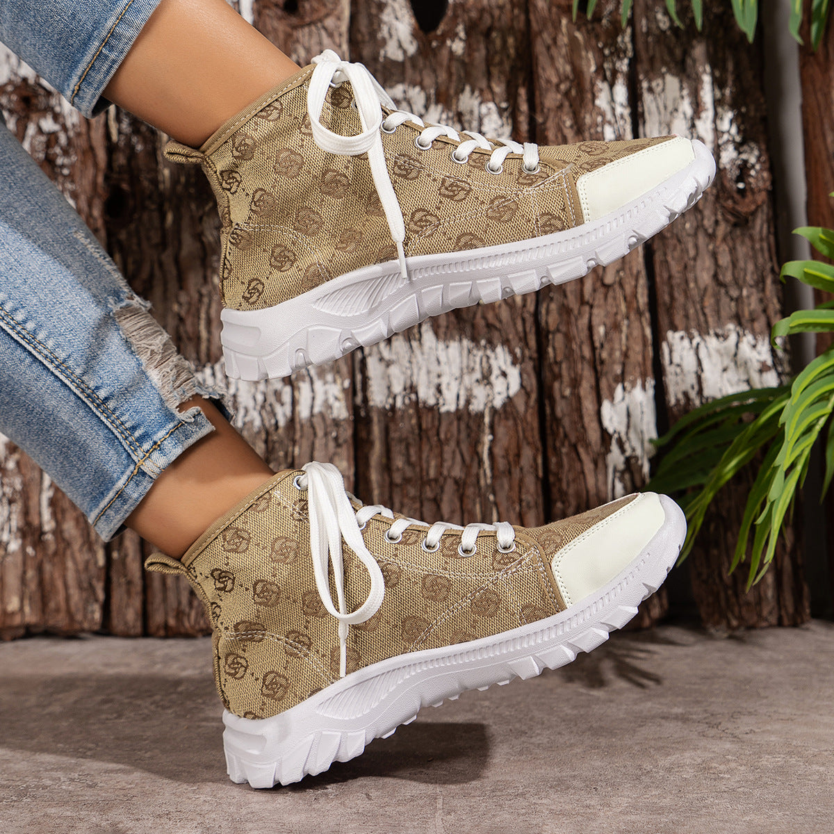 Khaki canvas lace-up high-top sneakers with white soles and white toe caps.