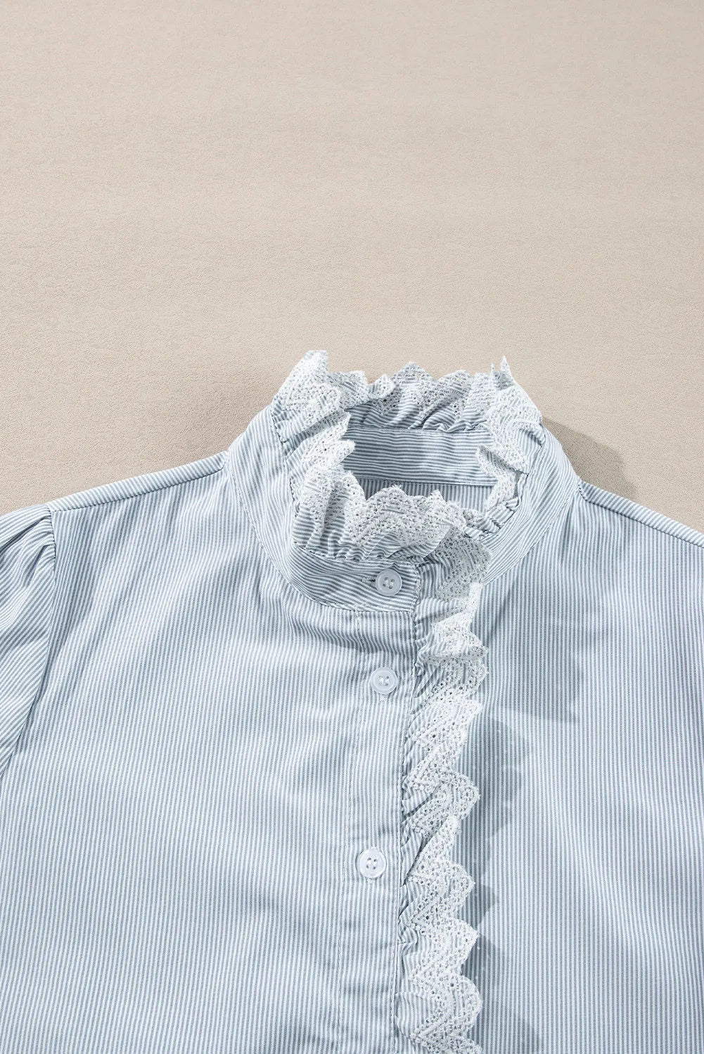 Pinstripe blouse with ruffled lace collar and button front
