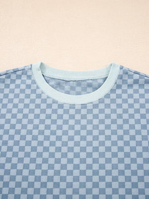 Light blue checkerboard loungewear pullover with crew neck and contrast trim.