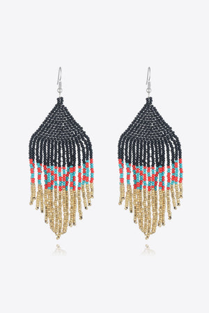 Geometric fringe beaded earrings in black, red, turquoise, and gold.