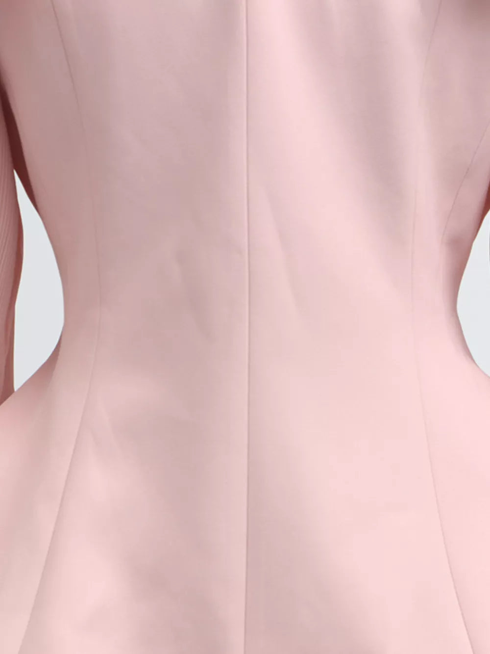 Pink skirt suit with balloon sleeves and a frill collar detail.