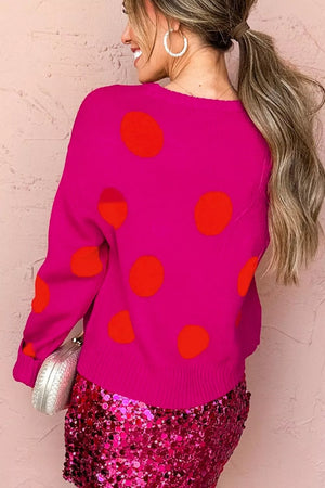 orange pullover sweater featuring ribbed and polka dot