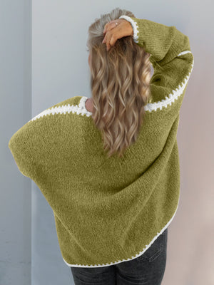 Oversized knit cardigan in Yellow-Green with white contrast stitching on the sleeves and hem.