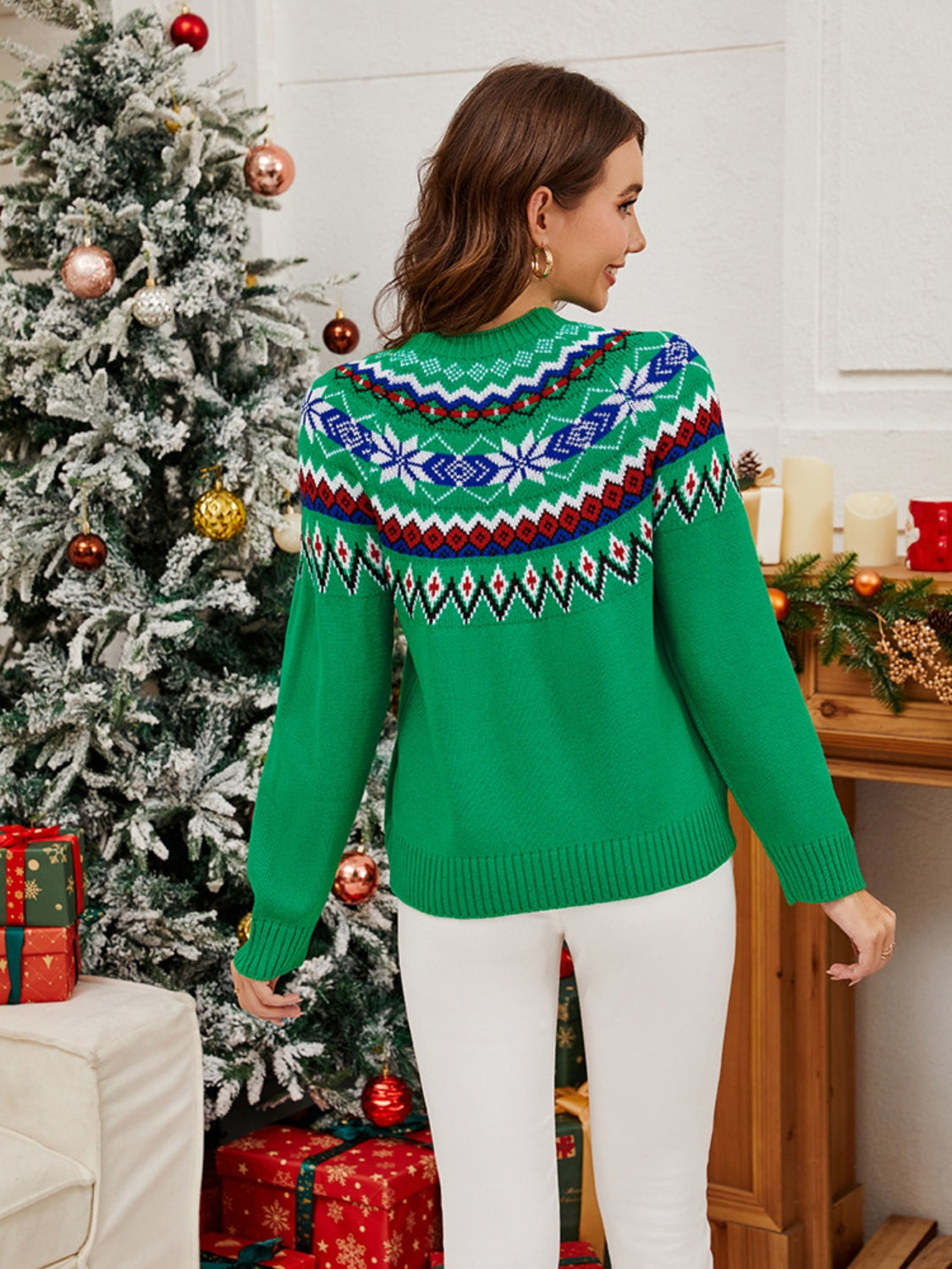 Green crewneck sweater with festive Fair Isle knit pattern and long sleeves.