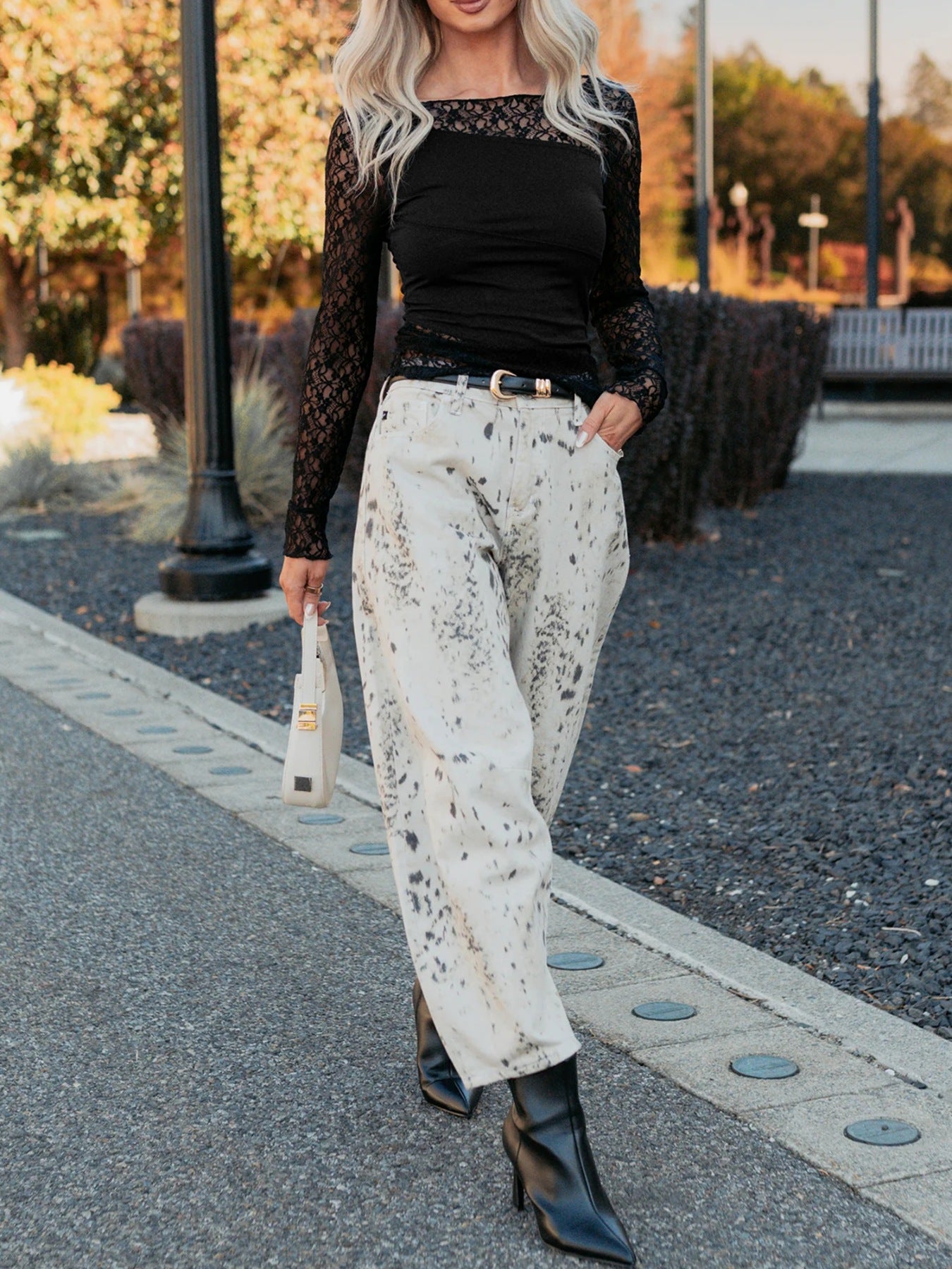 Black lace-trimmed sheer shirt with a square neckline and long sleeves.