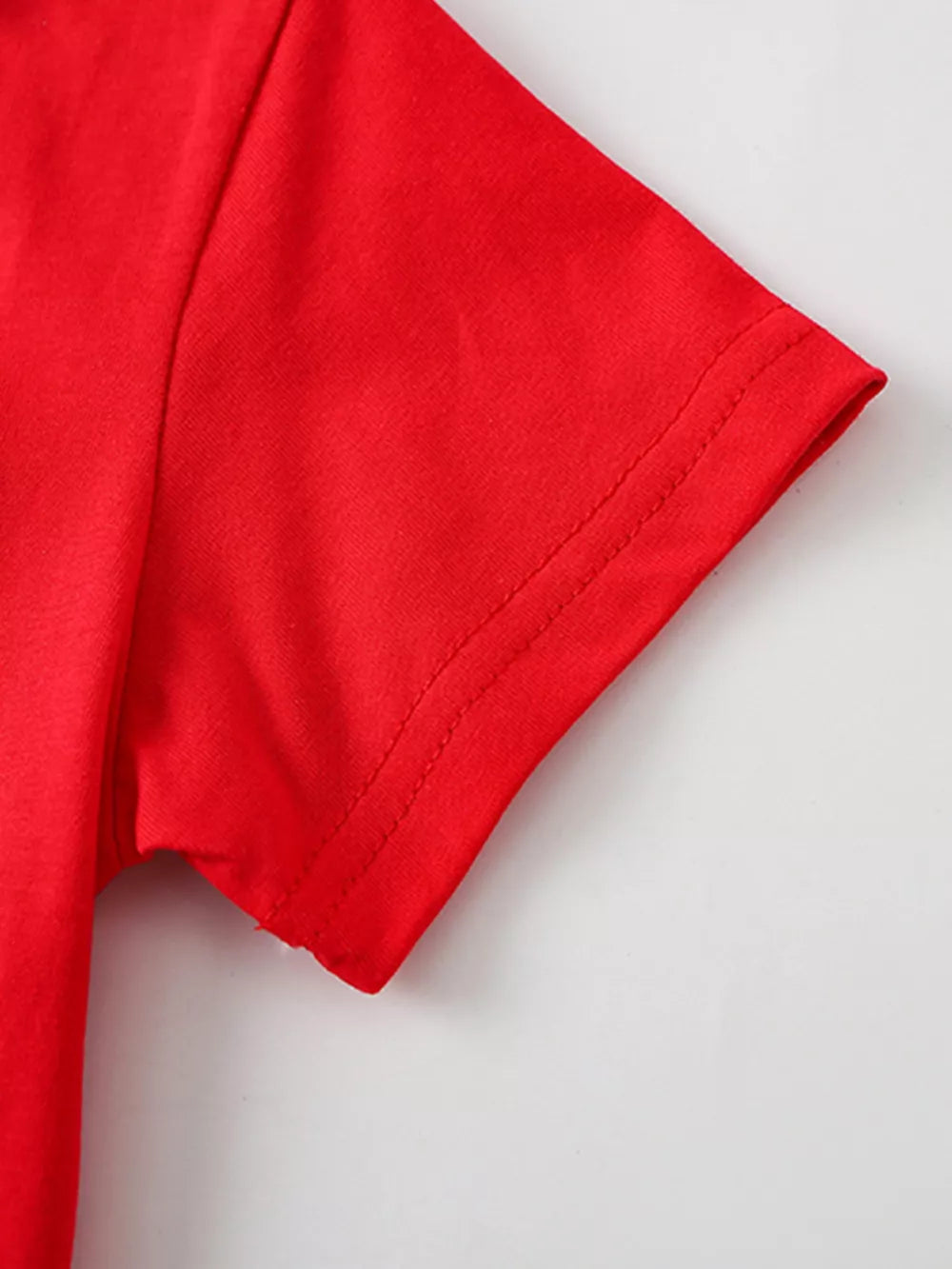 Red cotton toddler t-shirt with short sleeves and double-stitched hem.
