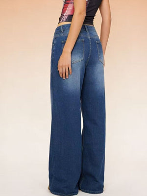 Cutout high-waisted wide-leg jeans in blue denim with a button closure.
