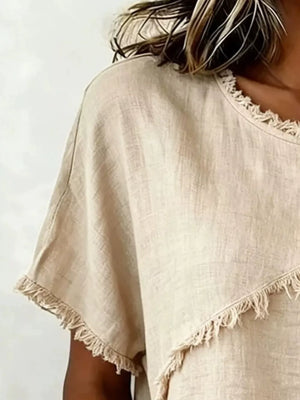 Khaki relaxed-fit short sleeve shirt with frayed hem and neckline detail.