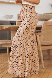 Dalmatian print palazzo trousers in watermelon pink with tiered skirt and adjustable drawstring waist.