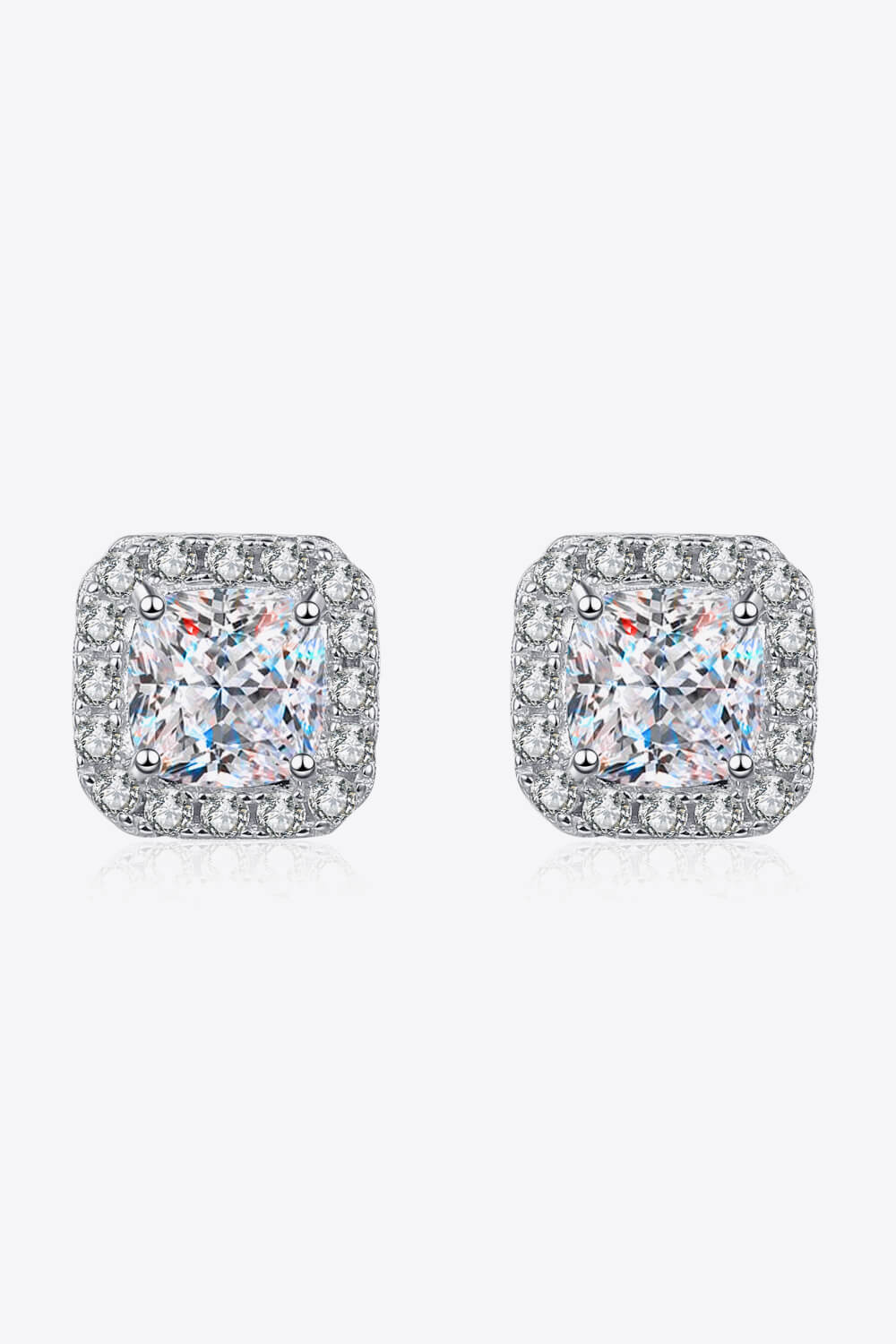 Silver square halo moissanite stud earrings with a cushion-cut center stone.