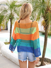 Rainbow mesh cover-up with flared sleeves in orange, green, turquoise, and blue stripes.