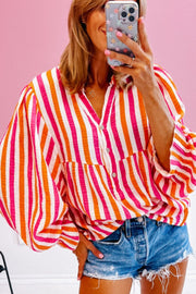Textured stripe blouse in red with gathered balloon sleeves and button front.