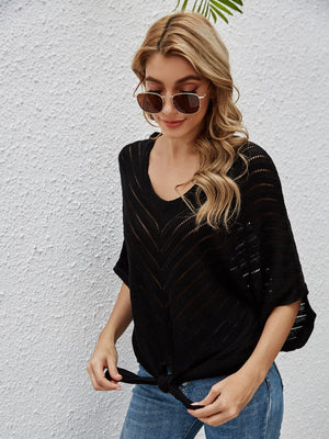 Black chevron knit tie-front cover-up with batwing sleeves and V-neck.
