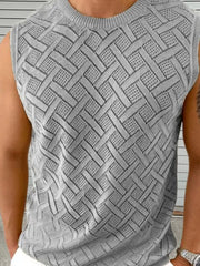 Gray geometric knit sleeveless sweater with a crew neck and open weave pattern.