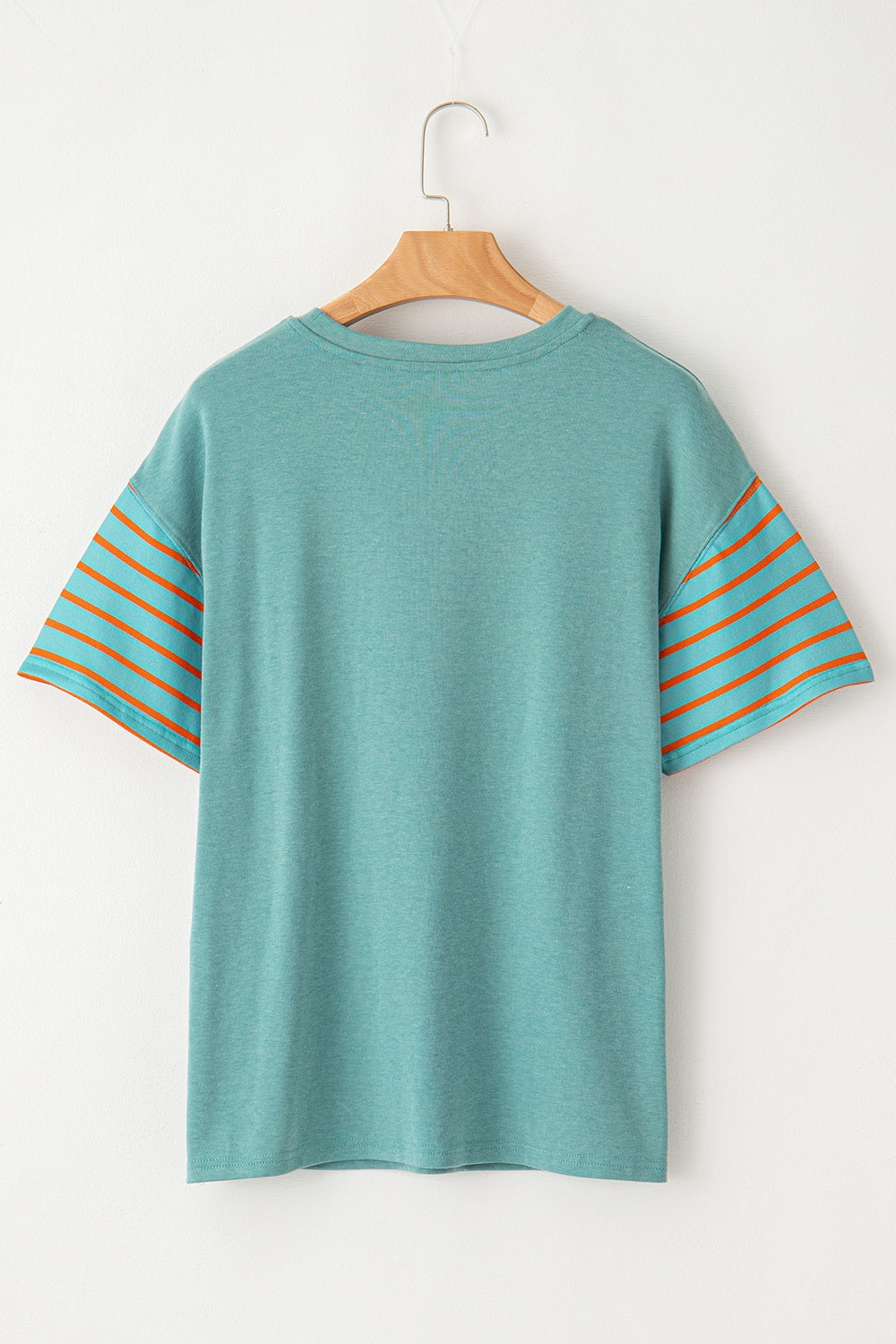 Turquoise raglan tee with orange striped sleeves and side slits