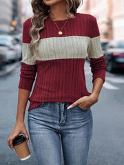 Ribbed crewneck sweater in burgundy and beige colorblock with long sleeves.