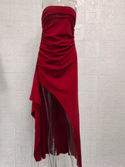 Burgundy strapless maxi dress with ruching and a high slit.