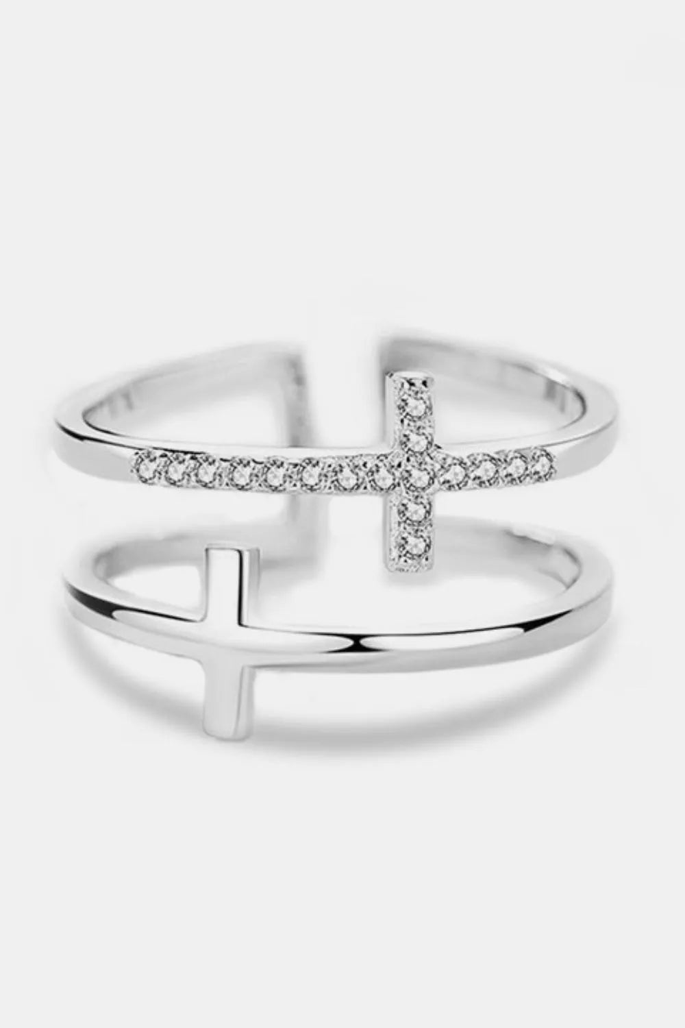 Silver double band ring with two cross embellishments, one with clear stones.
