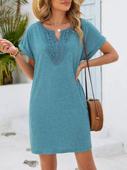 Dusty blue V-neck dress with lace inset and short sleeves.