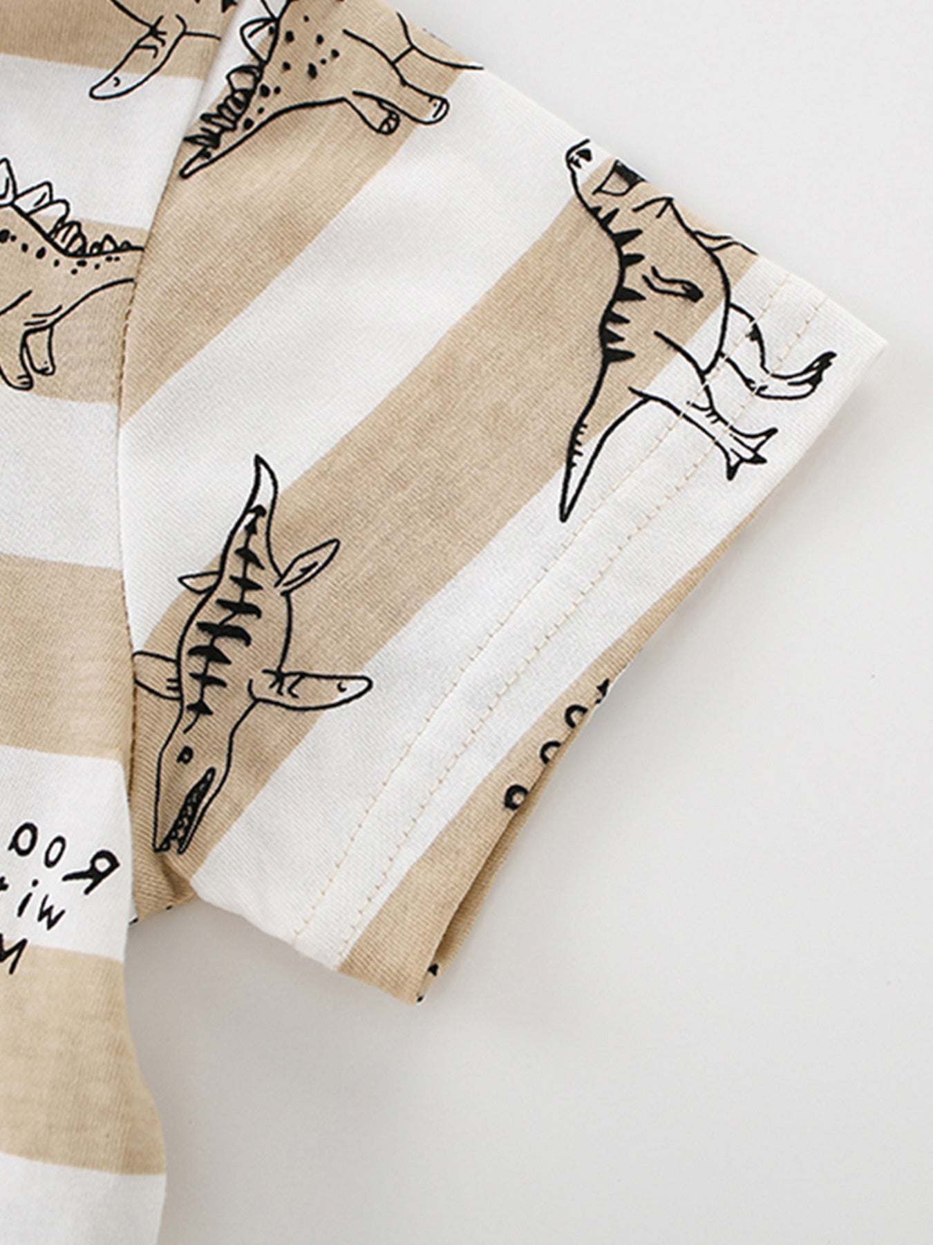 Toddler t-shirt with beige and white stripes and dinosaur print.