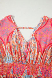 Paisley print boho dress with V-neck, short sleeves, and smocked waist detail.