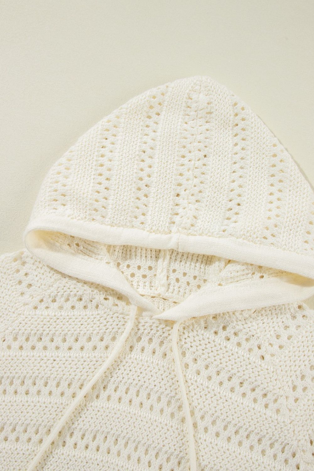 Openwork knit hoodie in beige with drawstring and hood detail