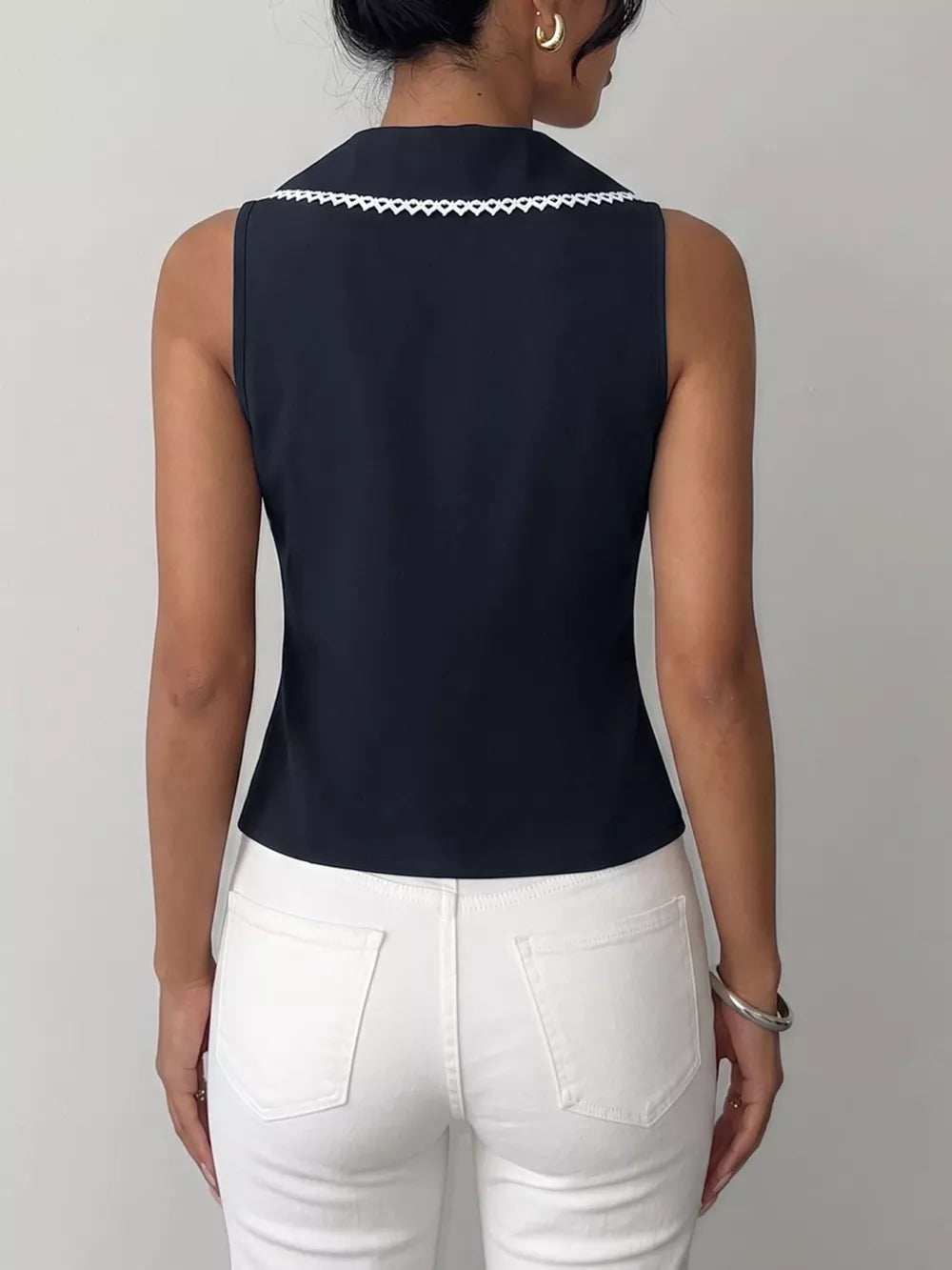 Navy lace-trimmed tie-front vest with a collar detail.