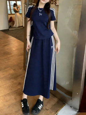 Dark blue striped tee and midi skirt ensemble with white stripe details and bow accent.