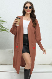 Brown long cardigan with balloon sleeves and red heart pocket details
