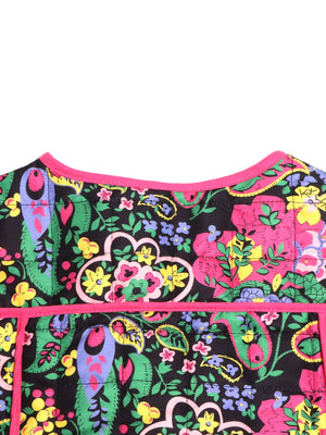 Paisley quilted jacket with bright floral print and pink trim.