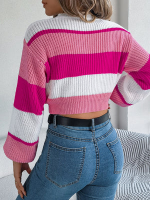 Striped crop knit sweater with balloon sleeves in pink, white, and cerise acrylic.