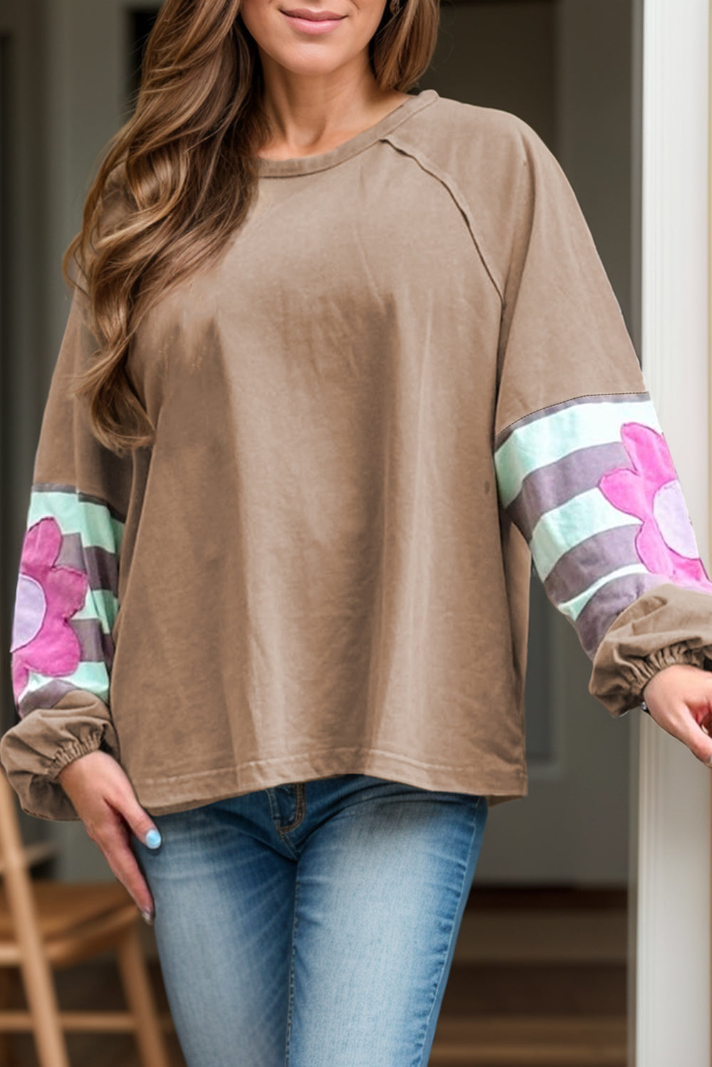 Camel raglan sleeve top with floral appliqué and striped sleeves