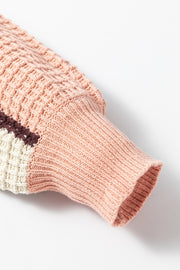 Waffle knit hoodie sleeve in pink with colorblock detail and ribbed cuff.