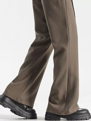 Relaxed fit wide-leg sweatpants in coffee, styled with chunky black shoes.