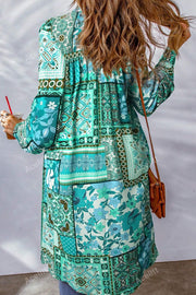 Patchwork print duster shirt jacket in turquoise with long sleeves and a boho pattern.