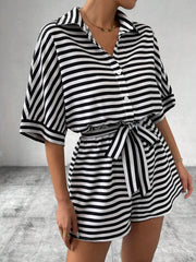 Black and white striped shirt romper with self-tie belt and button front.