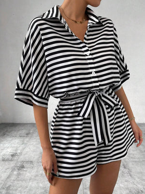 Black and white striped shirt romper with self-tie belt and button front.