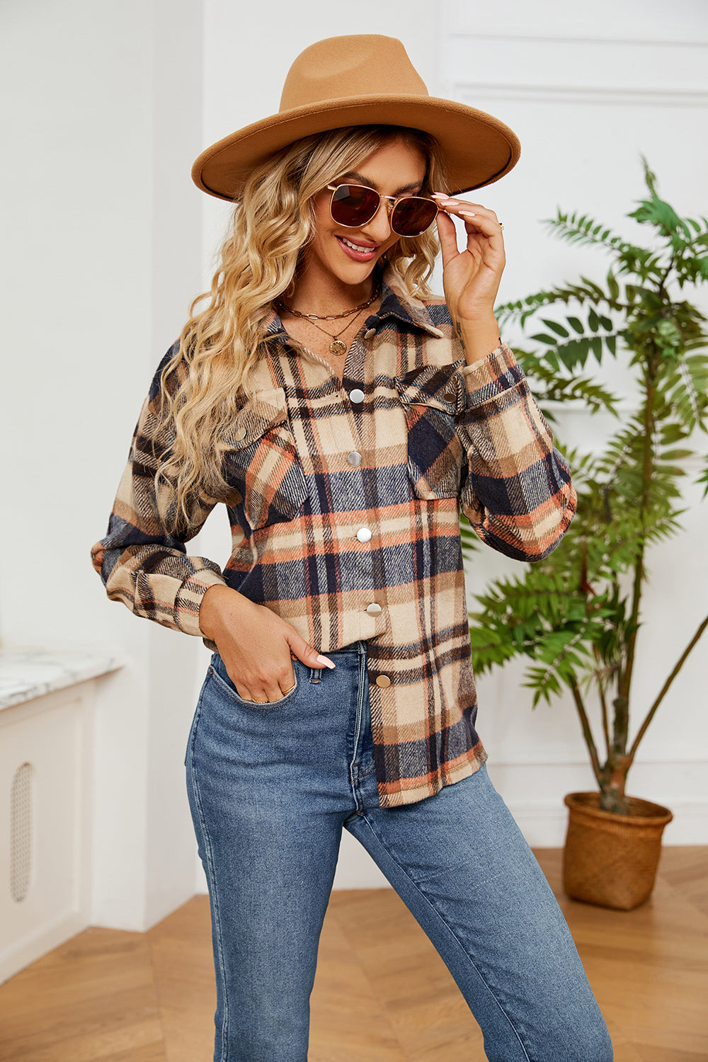 Soft plaid overshirt with patch pockets and button front in tan, navy, and orange.