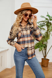 Soft plaid overshirt with patch pockets and button front in tan, navy, and orange.