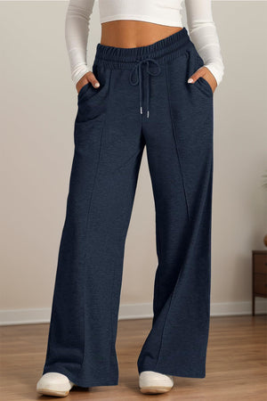 Navy seamed palazzo lounge trousers with drawstring waist and pockets.