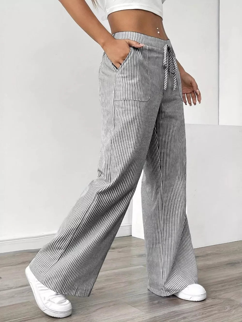 Chic striped drawstring maternity pants with pockets and wide legs.