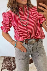 Red and white striped cotton shirt with ruffled sleeves and button front, styled with jewelry.