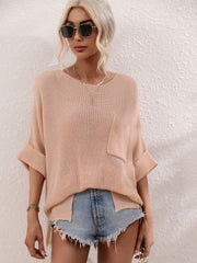 Relaxed knit tunic top in peach with boat neck, short sleeves, and chest pocket.