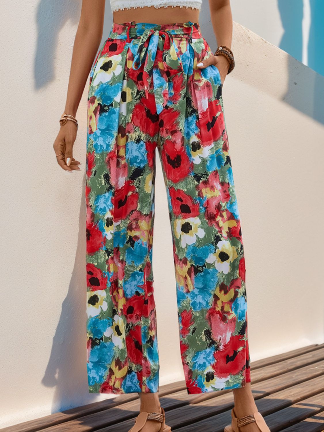 Painterly floral wide-leg trousers with a tie waist and pockets.